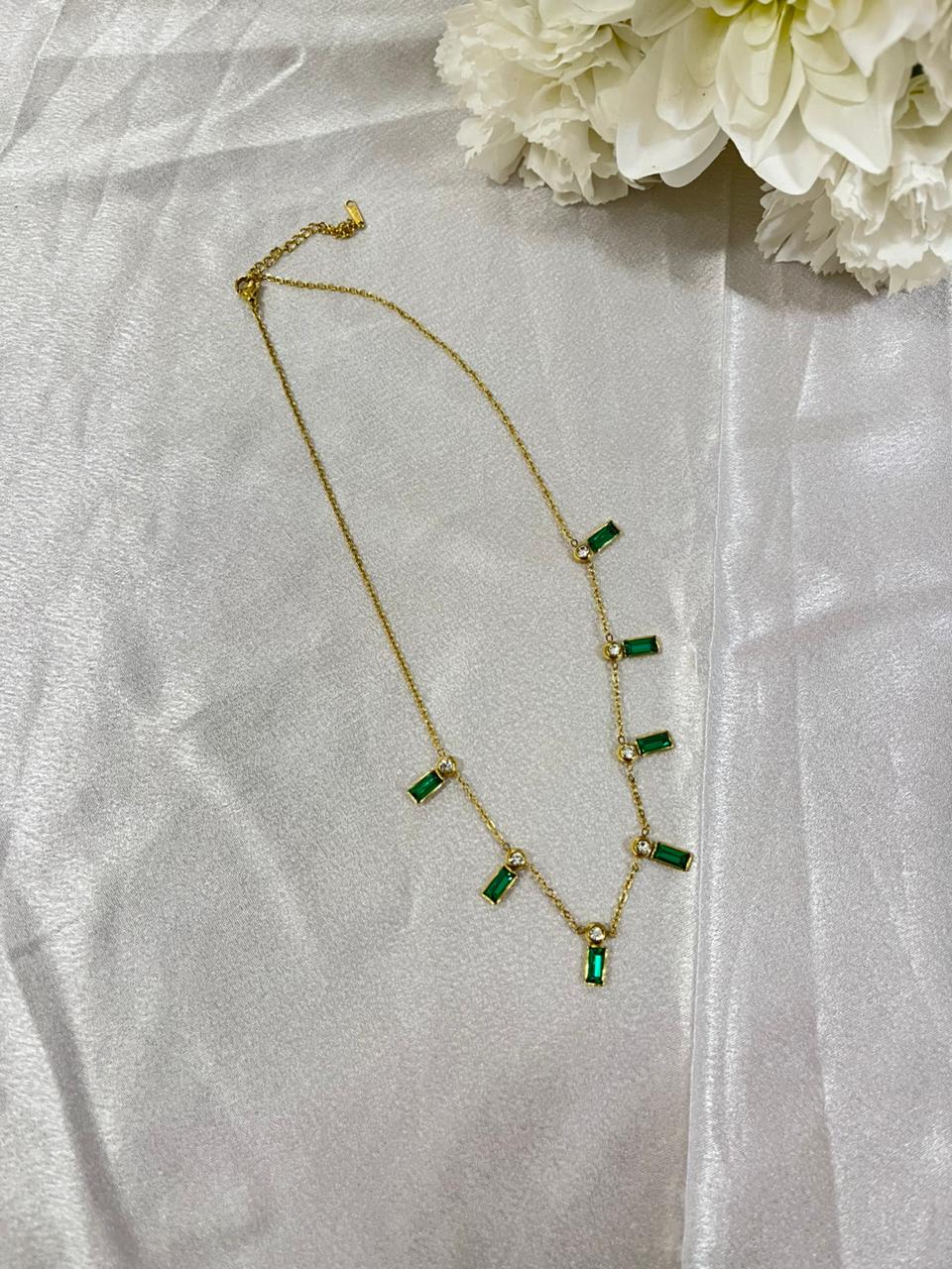 emerald charm necklace.